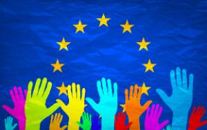 Emerging hands in fron of the EU flag